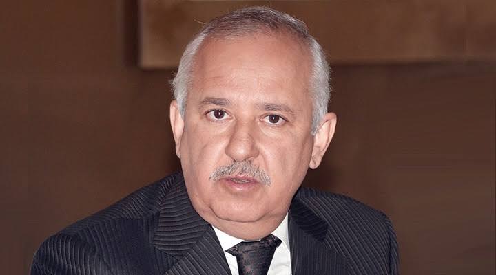 Close-up portrait of Anas Sefrioui in a dark suit